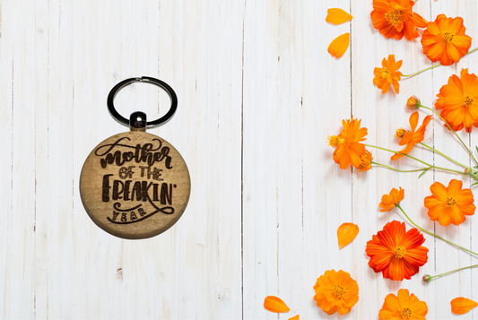 Wooden keychain with engraved text "Mother of the freaking year"