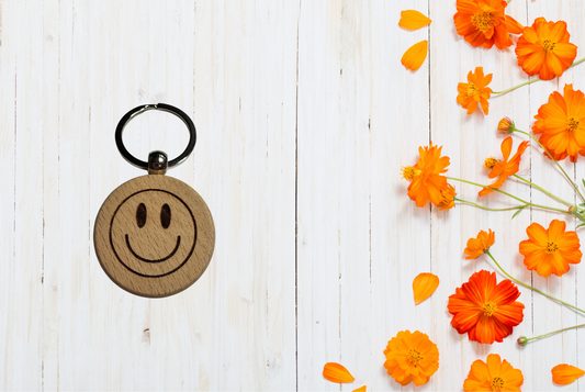 Wooden keychain with smiley face design 