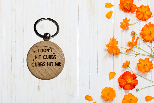 Keychain with humorous text on a wooden tag 