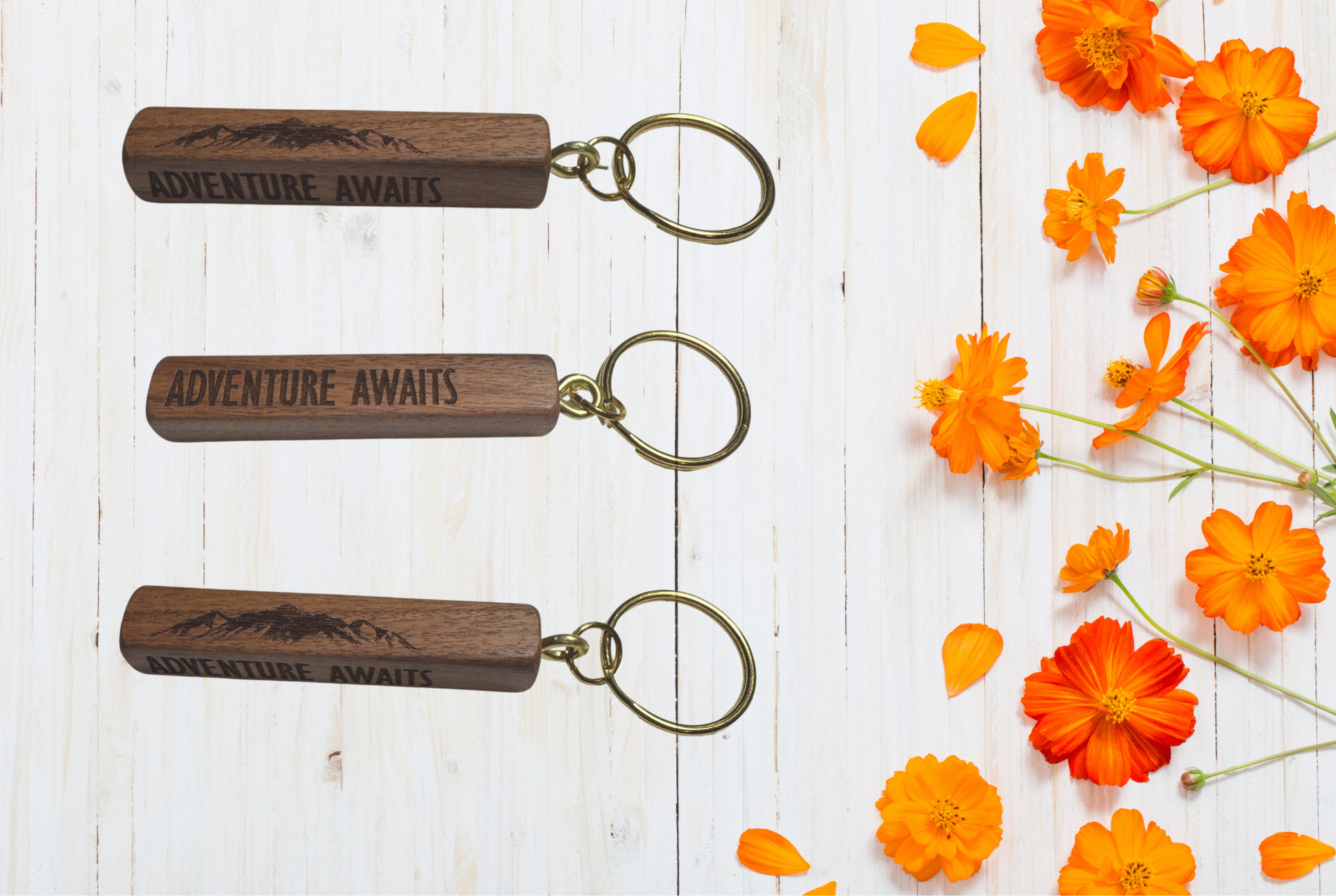 Wooden keychains with 'Adventure Awaits' engraving 