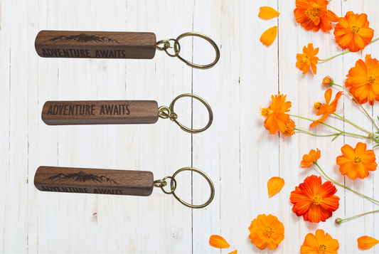 Wooden keychains with 'Adventure Awaits' engraving 