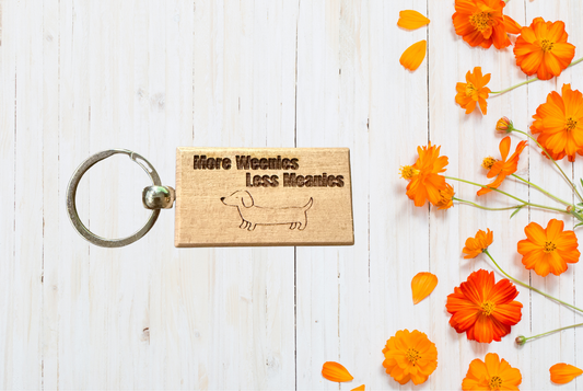 More Weenies, Less Meanies Wood Keychain