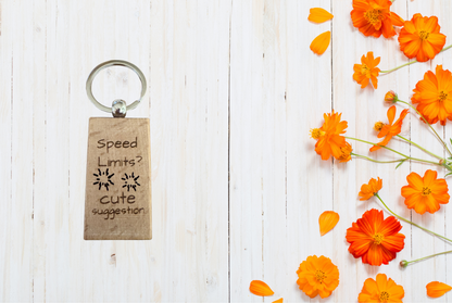 Wood keychain with humorous text 